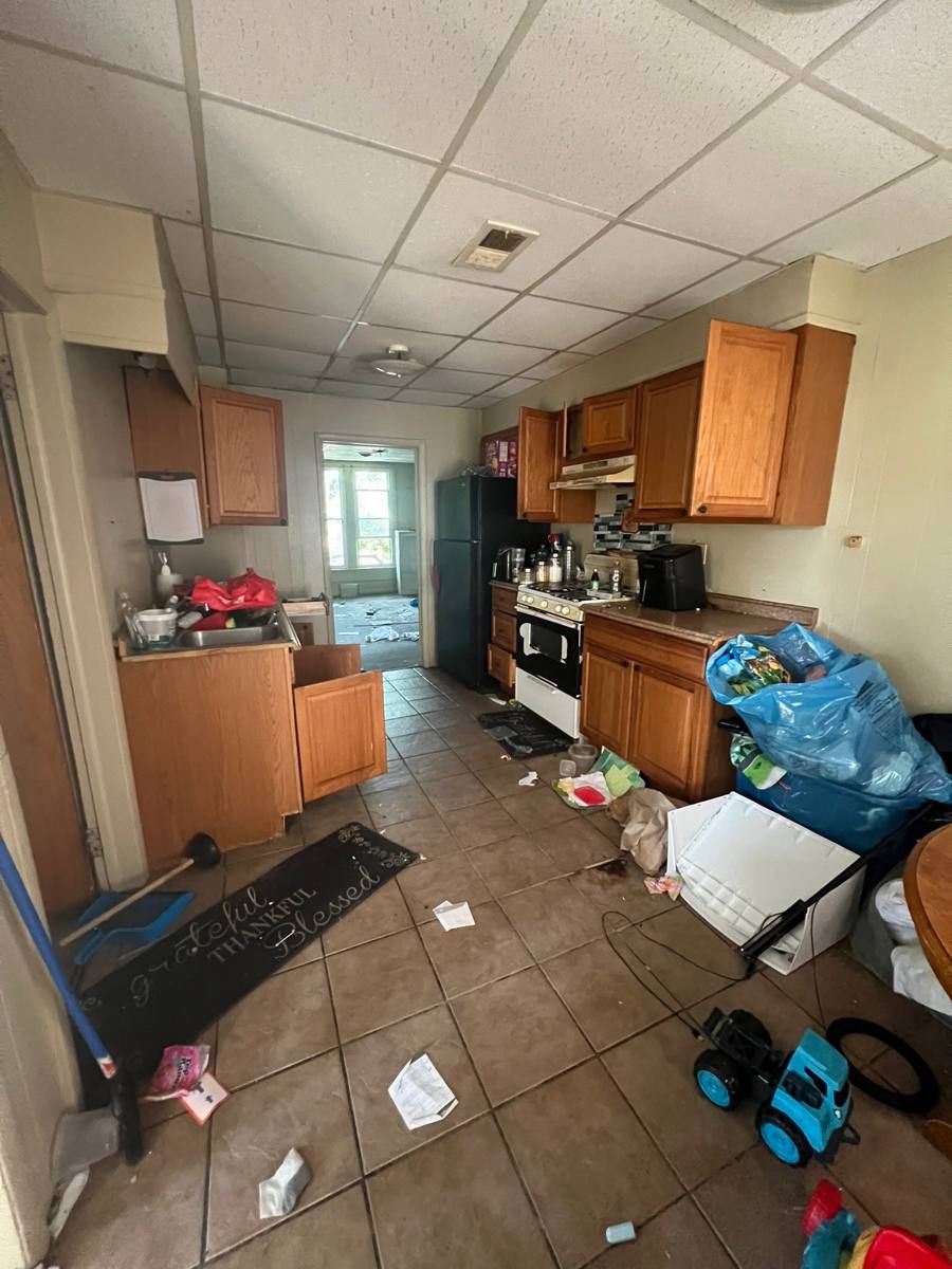 A damaged kitchen in a house we bought as-is